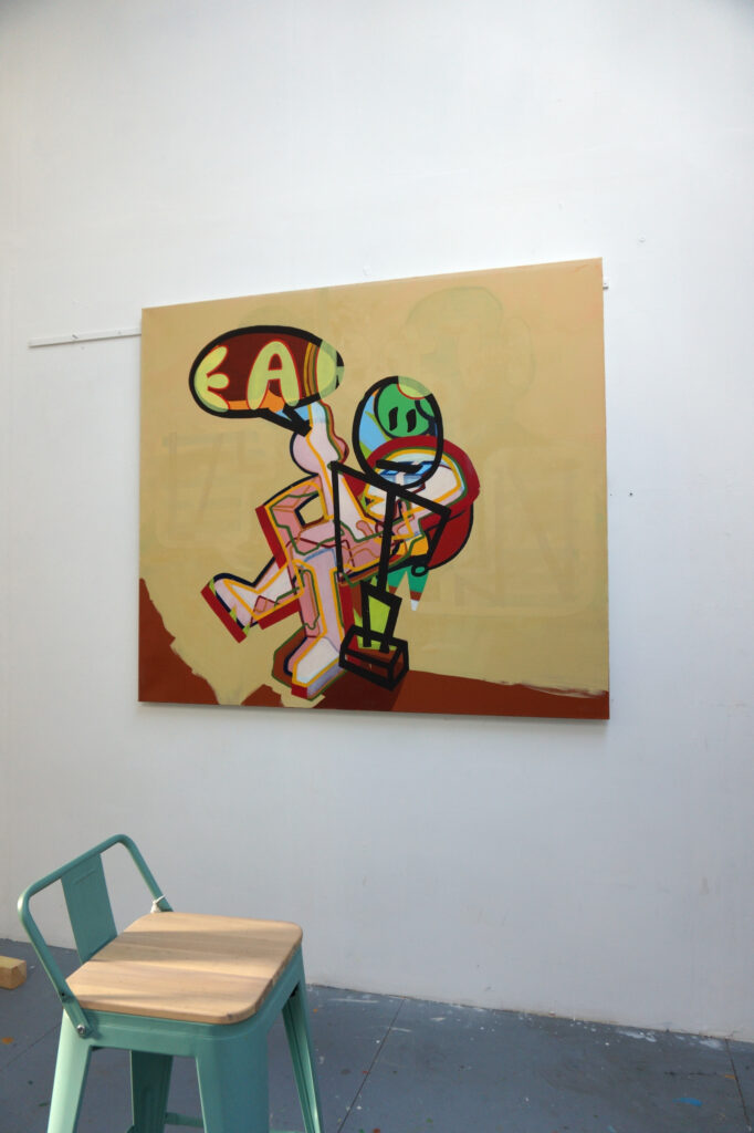 Ici on peut voir une peinture de Benoît Andro qui représente deux personnages robotiques superposés et l’image qui en résulte est donc brouillée.